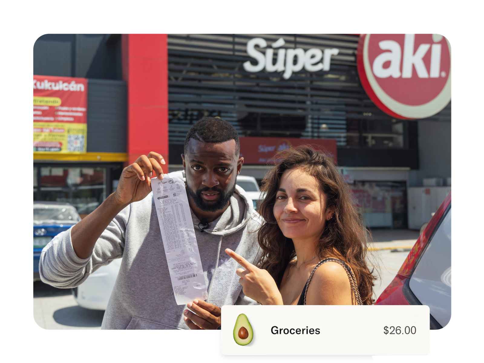 Capital George with a store receipt outside Super Aki.